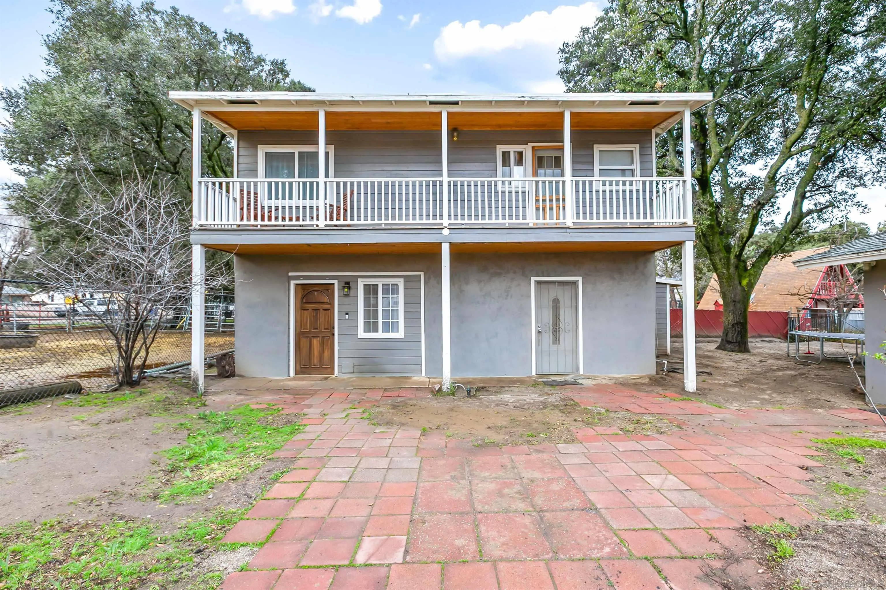 2414 Sage Drive Campo, CA 91906 - Photo 12 of 33 a front view of a house with a yard and garage