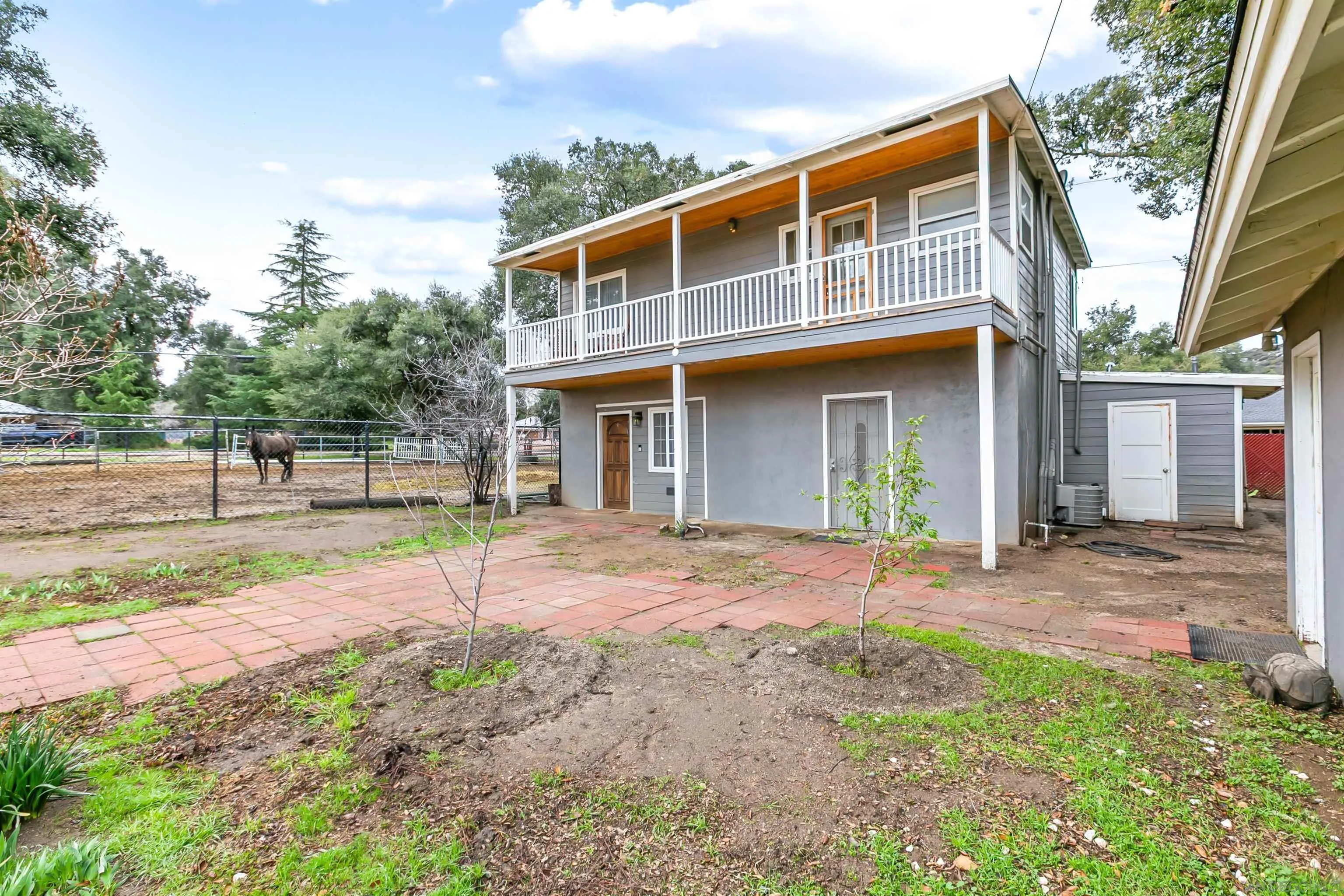 2414 Sage Drive Campo, CA 91906 - Photo 13 of 33 a front view of a house with a yard and garage