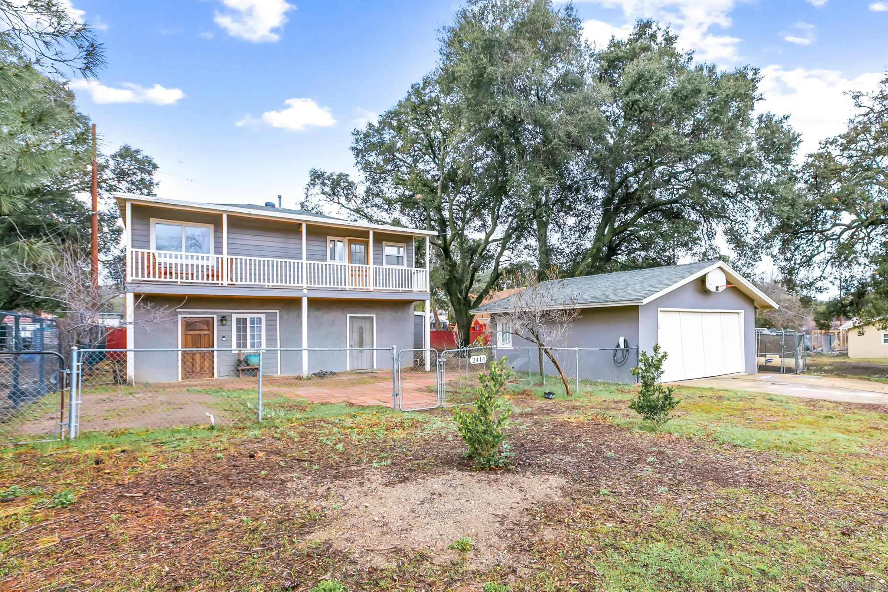 2414 Sage Drive Campo, CA 91906 - Photo 18 of 33 a view of a yard in front of a house with large tree