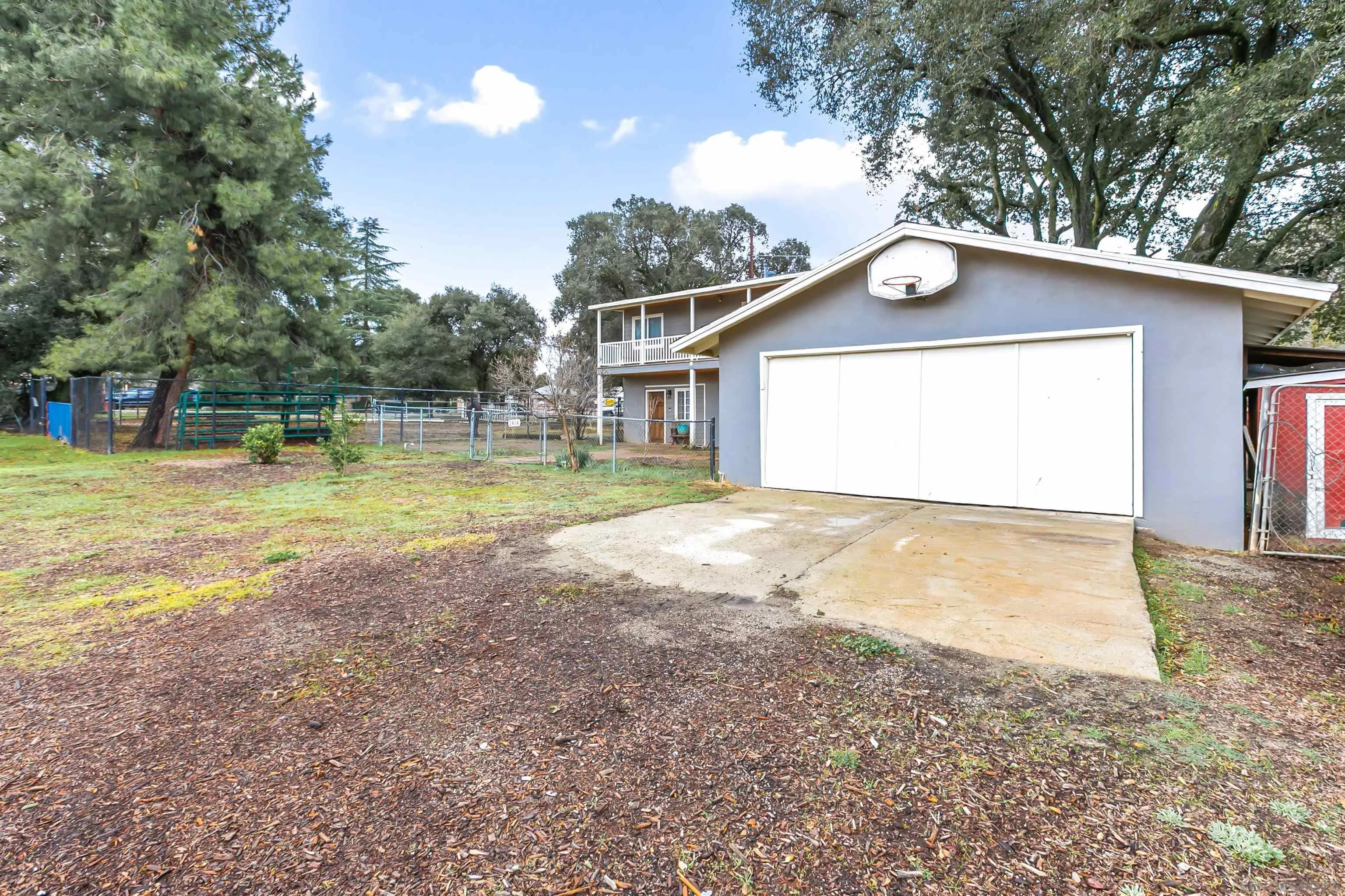 2414 Sage Drive Campo, CA 91906 - Photo 19 of 33 a view of a house with a yard and a large tree