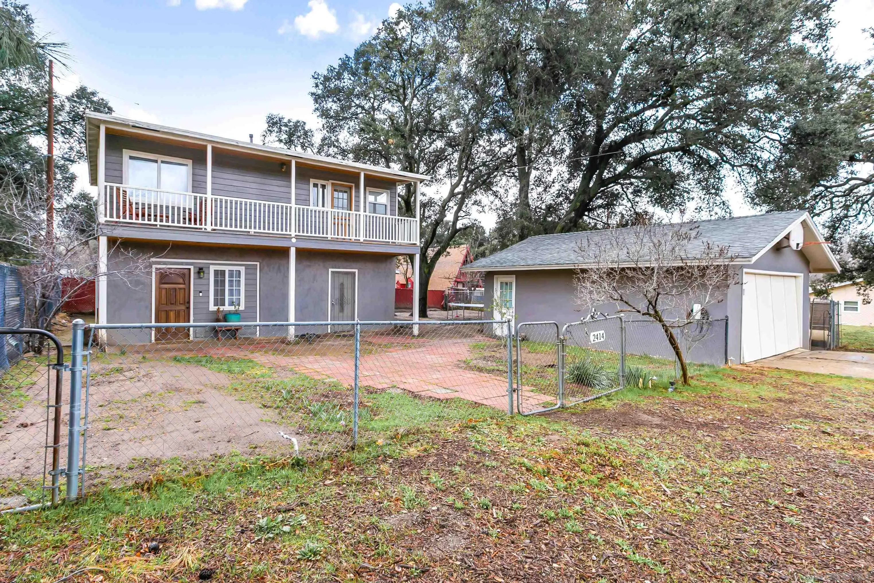 2414 Sage Drive Campo, CA 91906 - Photo 21 of 33 a house that has a tree in front of it