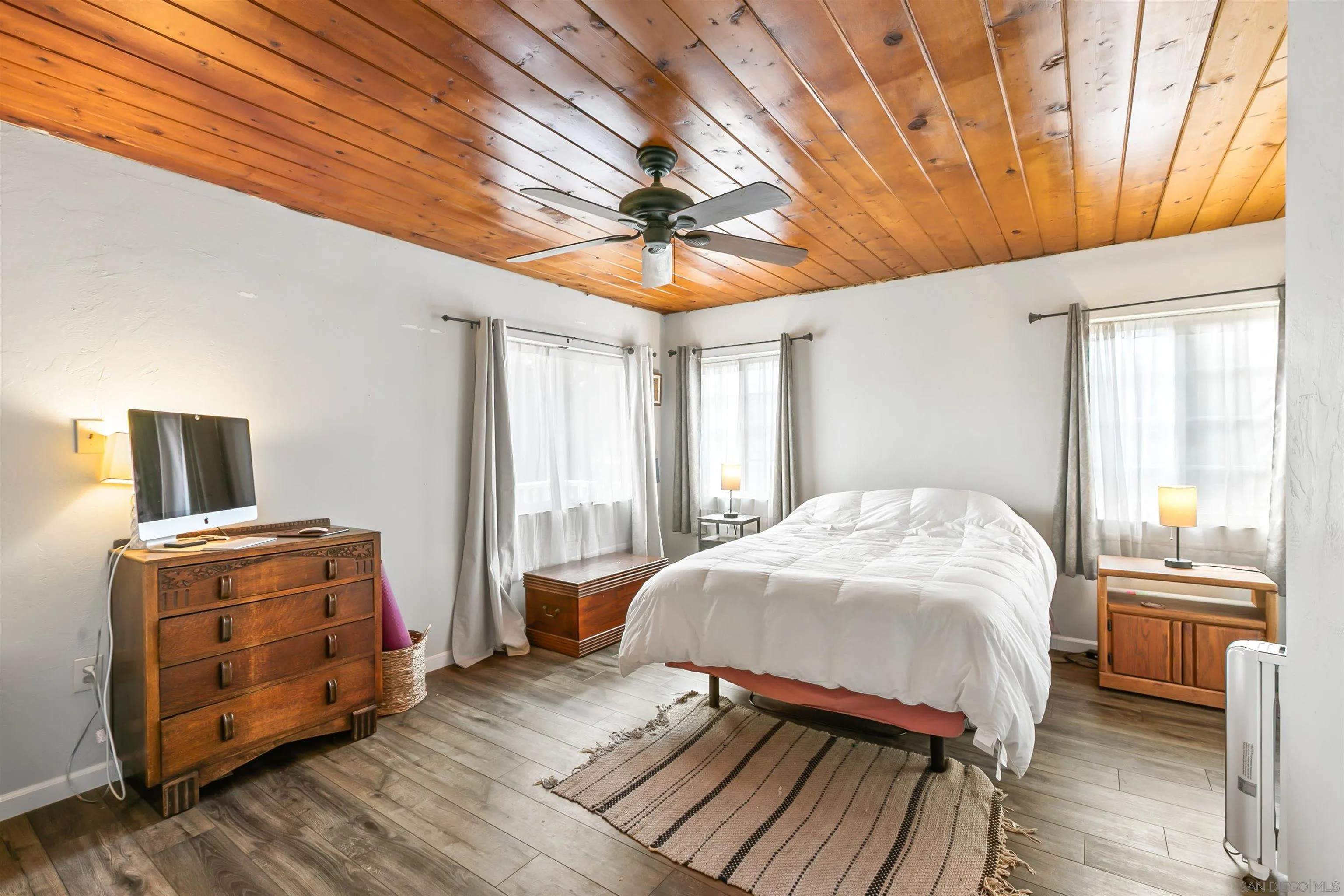 2414 Sage Drive Campo, CA 91906 - Photo 26 of 33 a bedroom with a bed and wooden floor