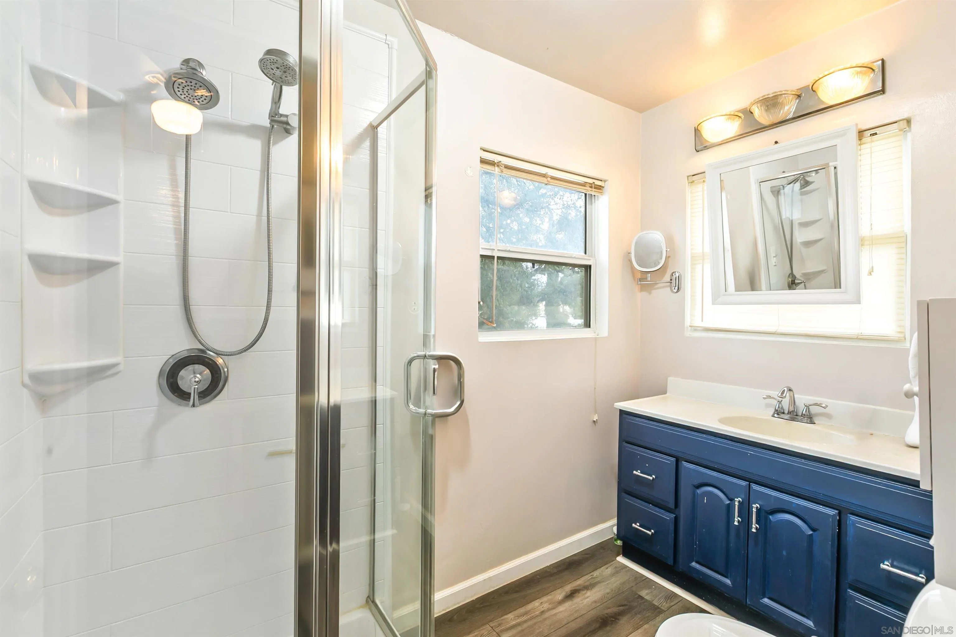 2414 Sage Drive Campo, CA 91906 - Photo 30 of 33 a bathroom with a shower sink and mirror