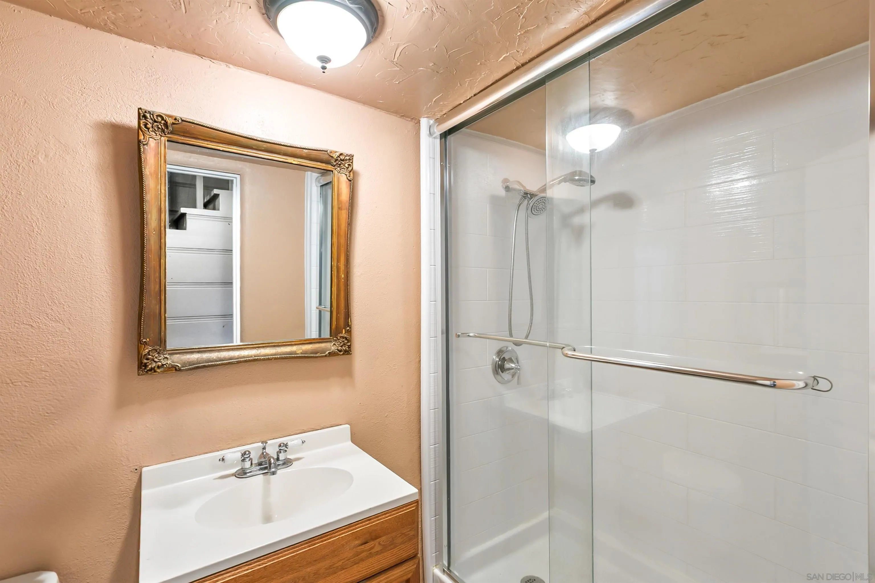 2414 Sage Drive Campo, CA 91906 - Photo 31 of 33 a bathroom with a sink vanity and a mirror