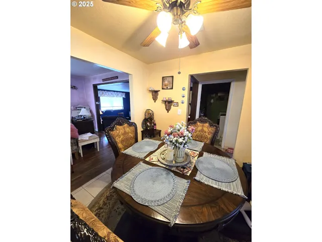 a dining room with furniture and window
