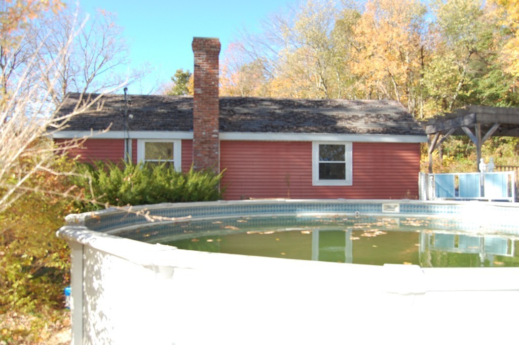 175 High Road Hardwick, MA 01031 - Photo 6 of 10 a view of a house with pool plants and large trees