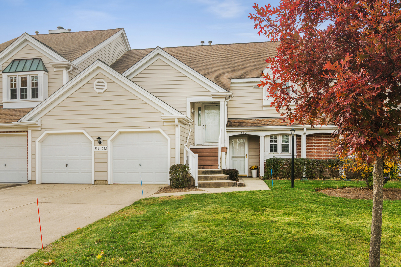 a view of a yard in front view of a house