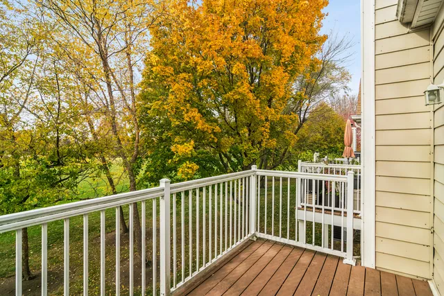 a view of balcony with wooden floor