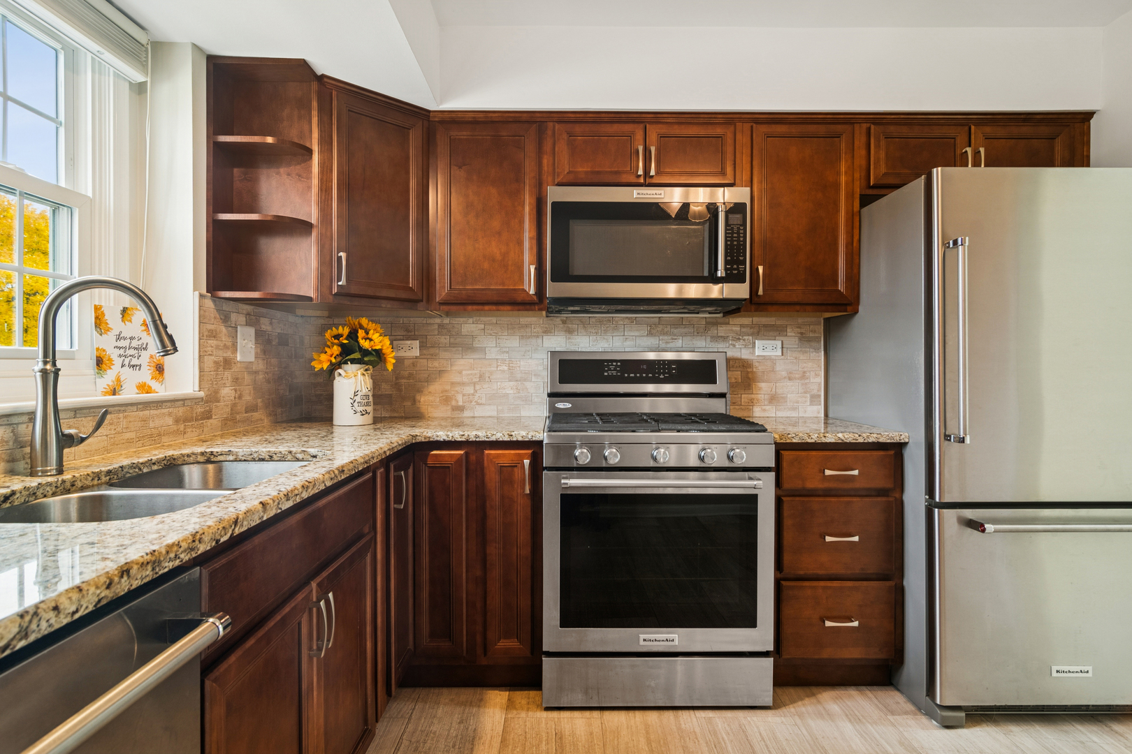 534 Park View Terrace, Unit 534 Buffalo Grove, IL 60089 - Photo 7 of 17 a kitchen with a refrigerator stove and sink