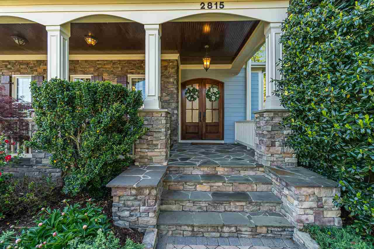 2815 Country Charm Road Raleigh, NC 27614 - Photo 2 of 30 Porch extends until garage and is perfect for rocking chairs. Front Porch