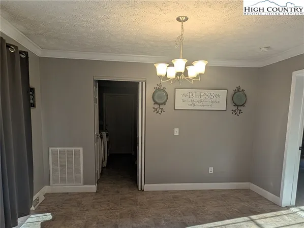 a view of a room with a mirror and a table