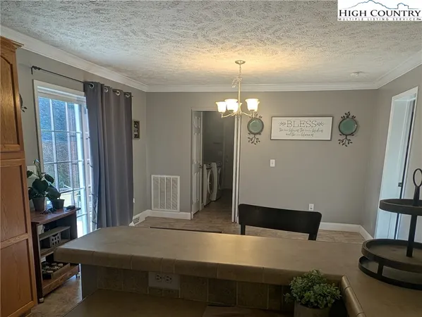 a view of a livingroom with furniture and window
