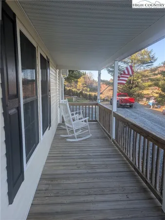 a view of a balcony with wooden floor