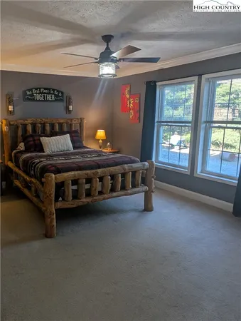 a bed room with a bed and a window