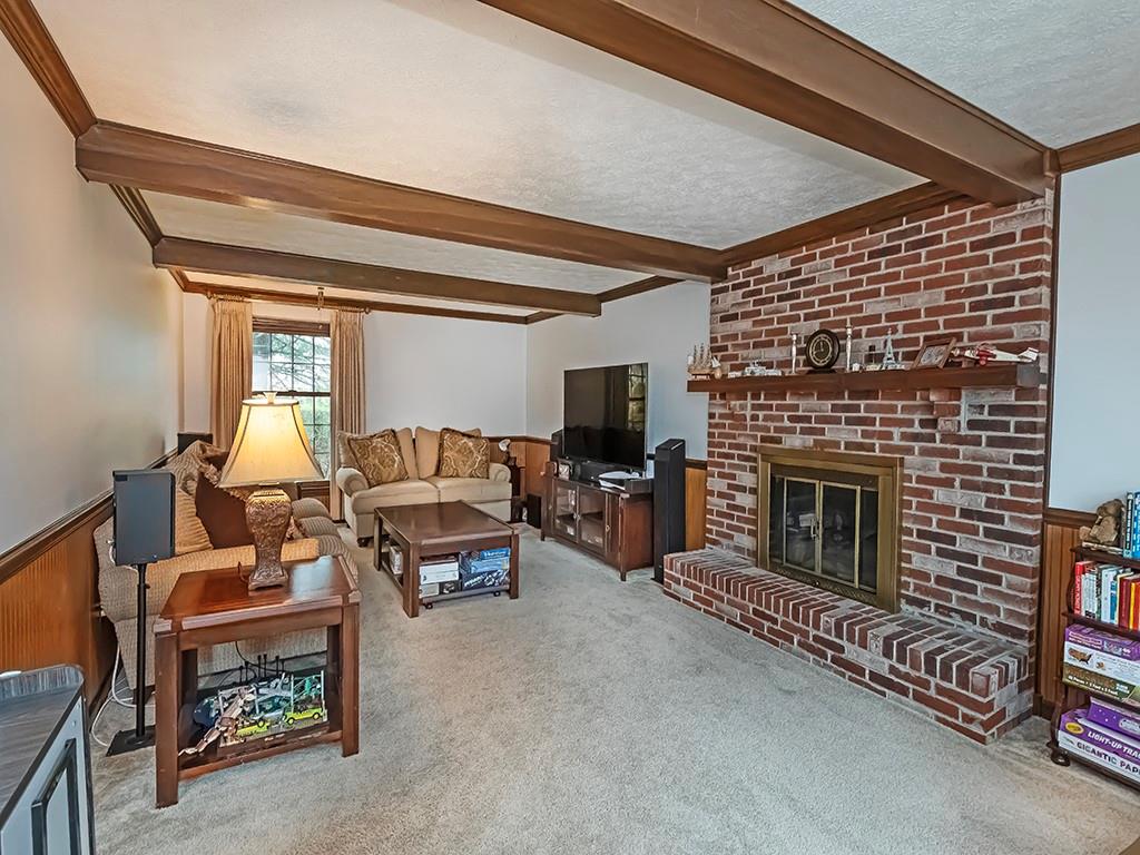 402 Dorseyville Road Pittsburgh, PA 15215 - Photo 11 of 33 a living room with furniture and a fireplace
