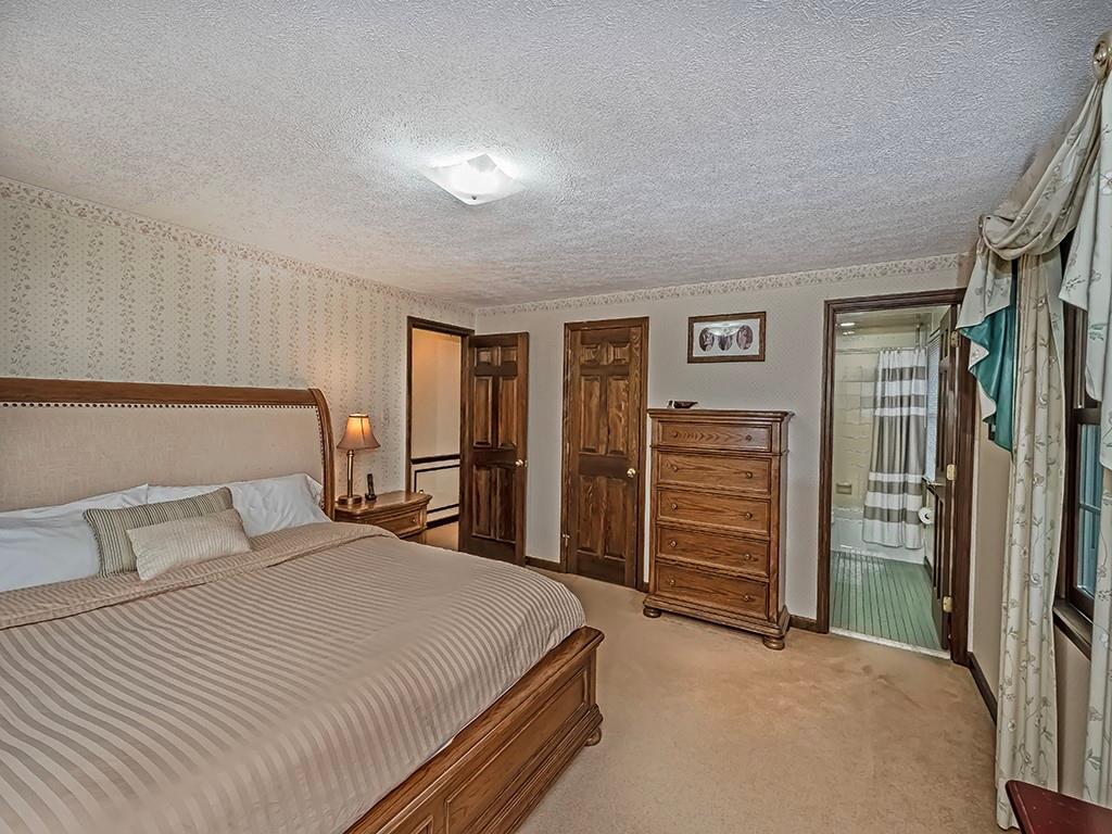 402 Dorseyville Road Pittsburgh, PA 15215 - Photo 14 of 33 a bedroom with a bed and a walk in closet