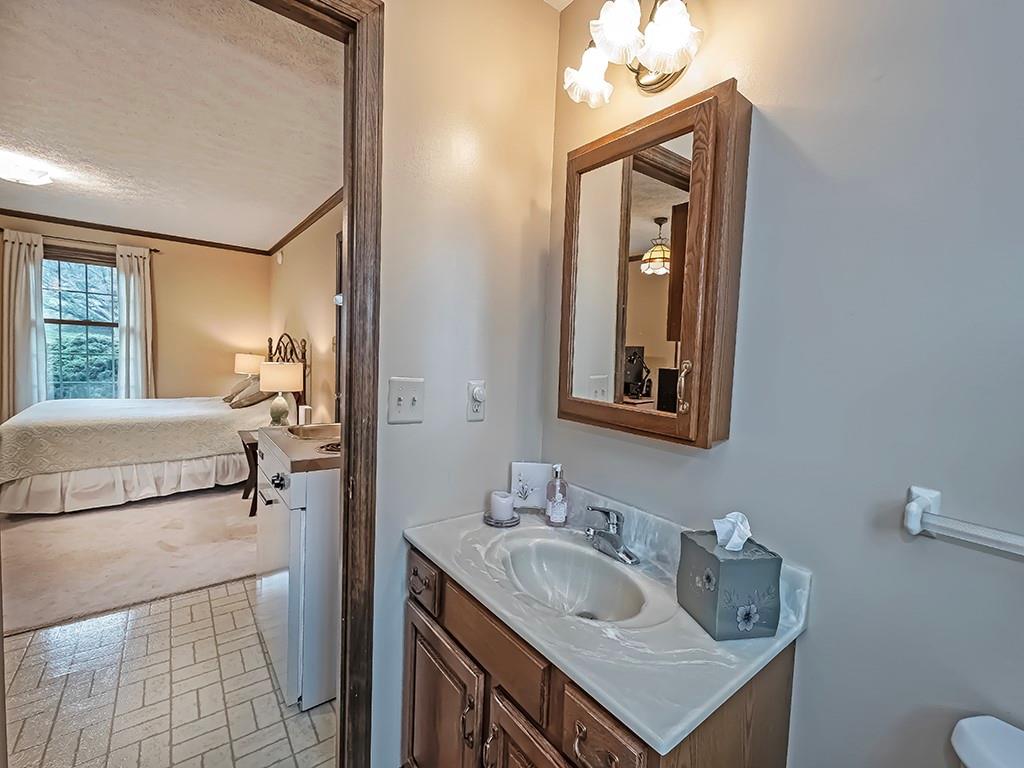 402 Dorseyville Road Pittsburgh, PA 15215 - Photo 25 of 33 a bathroom with a sink vanity and mirror