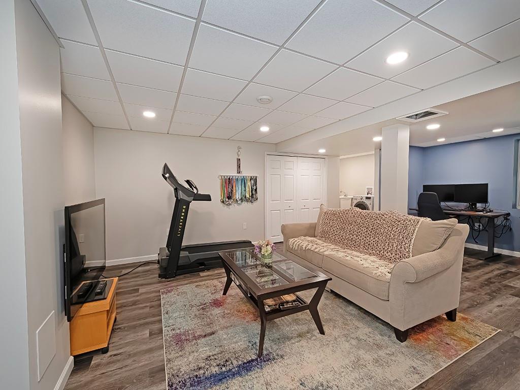 402 Dorseyville Road Pittsburgh, PA 15215 - Photo 27 of 33 a living room with furniture a flat screen tv and a table