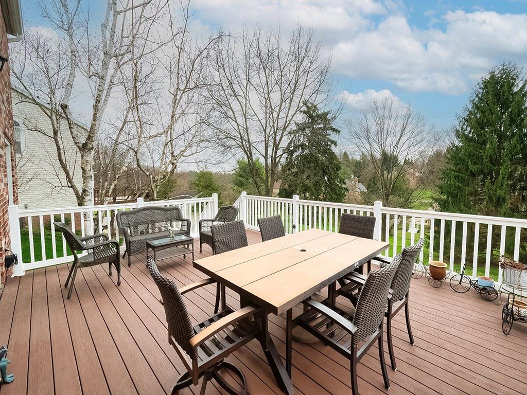 402 Dorseyville Road Pittsburgh, PA 15215 - Photo 30 of 33 a view of a roof deck with table and chairs and wooden floor