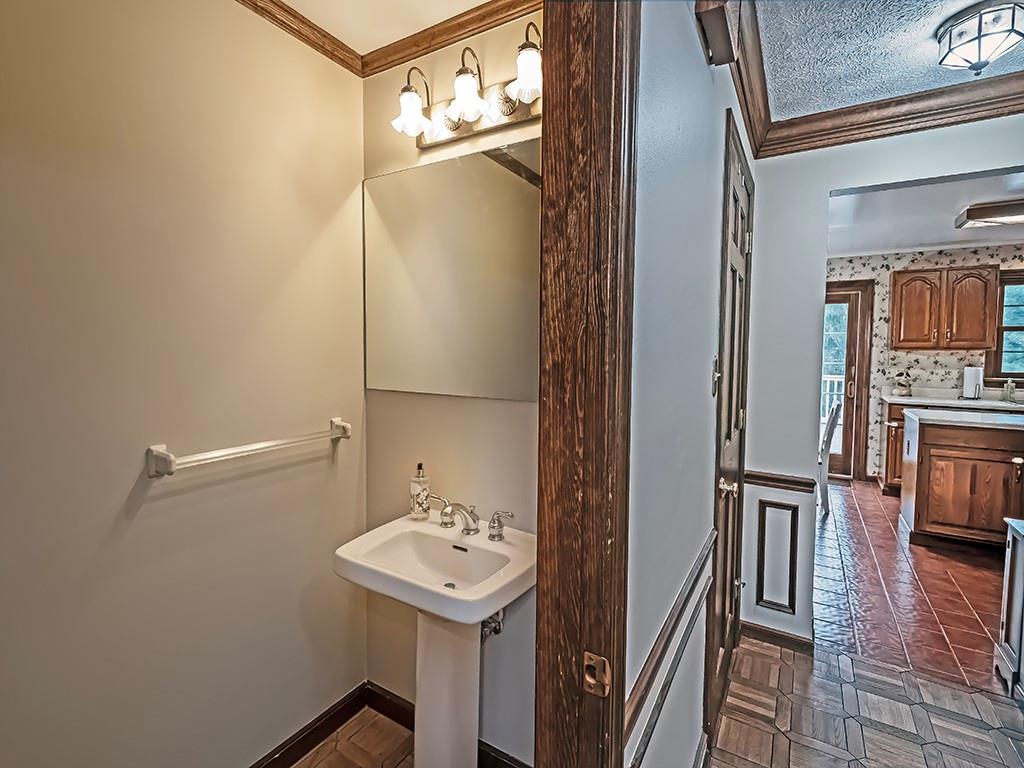 402 Dorseyville Road Pittsburgh, PA 15215 - Photo 4 of 33 a bathroom with a sink a mirror and a shower