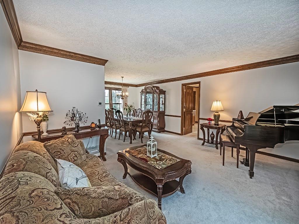 402 Dorseyville Road Pittsburgh, PA 15215 - Photo 5 of 33 a living room with furniture a lamp and a potted plant