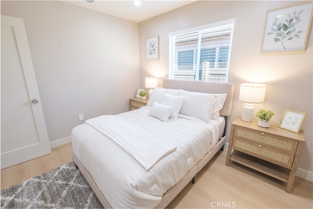 223 South Aprilia Avenue Compton, CA 90220 - Photo 19 of 46 a bedroom with a bed and a window