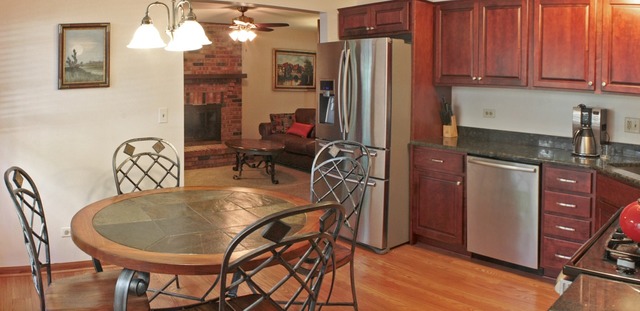 1636 Fender Road Naperville, IL 60565 - Photo 4 of 20 a dining table with chairs and wooden floor