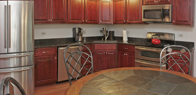 1636 Fender Road Naperville, IL 60565 - Photo 5 of 20 a kitchen with stainless steel appliances granite countertop a stove a refrigerator and a microwave