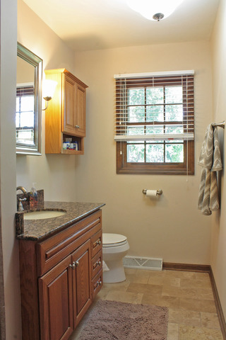 1636 Fender Road Naperville, IL 60565 - Photo 10 of 20 a bathroom with a sink a toilet and a window