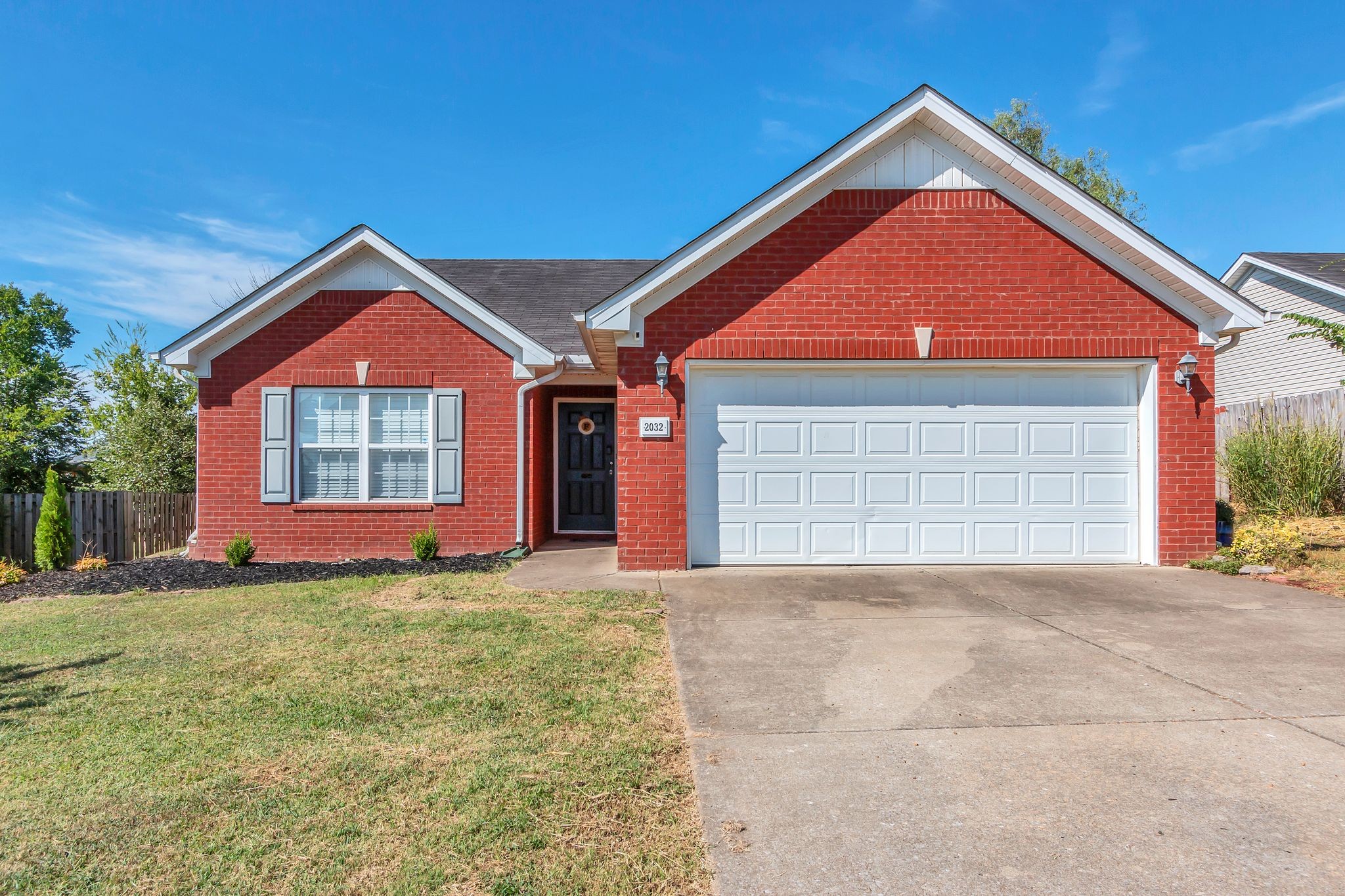 2032 Red Jacket Trace Spring Hill, TN 37174 - Photo 1 of 33 a front view of a house with a yard and garage