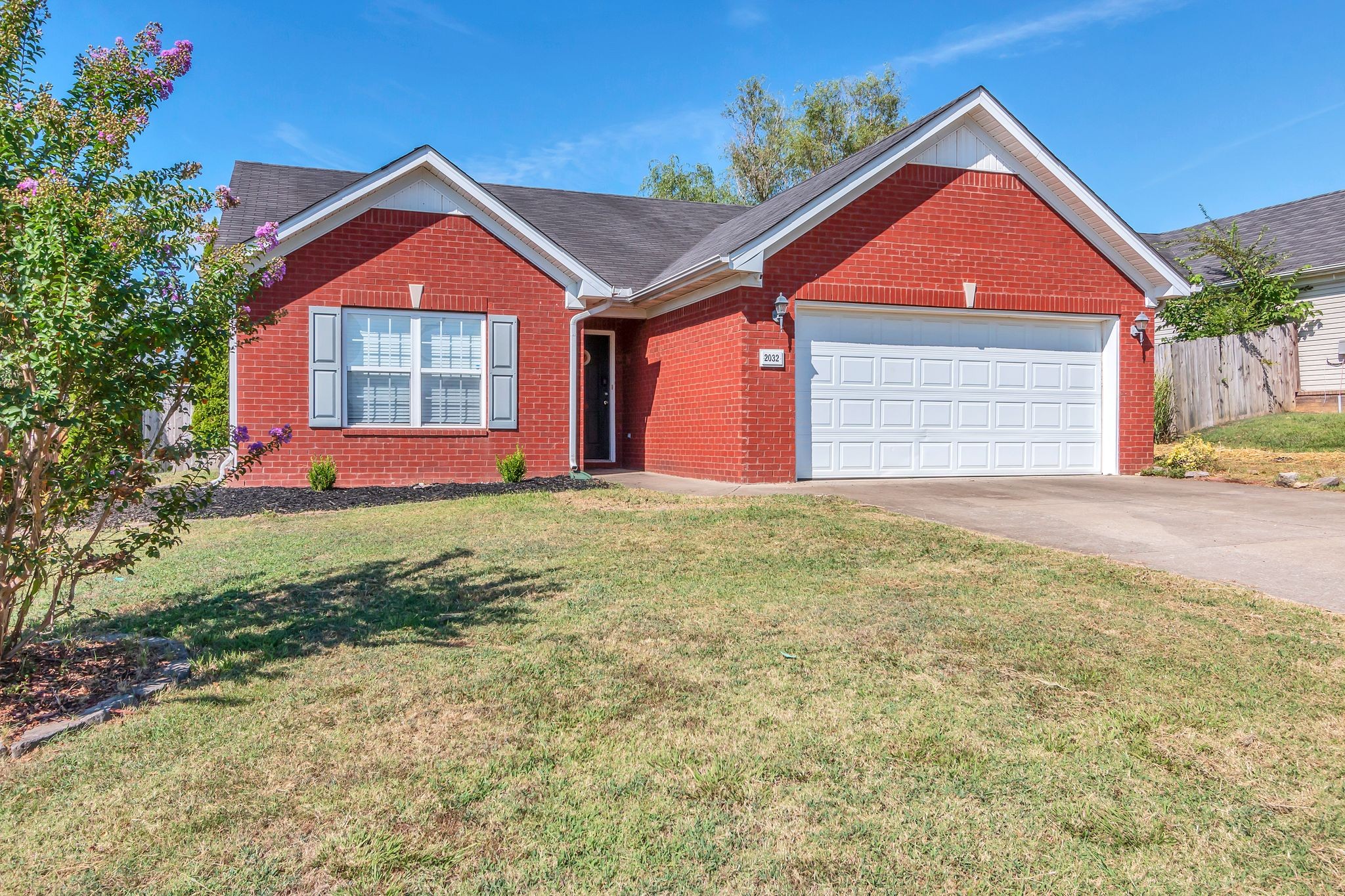 2032 Red Jacket Trace Spring Hill, TN 37174 - Photo 4 of 33 a front view of a house with a yard and garage