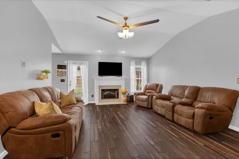 a living room with furniture and a fireplace