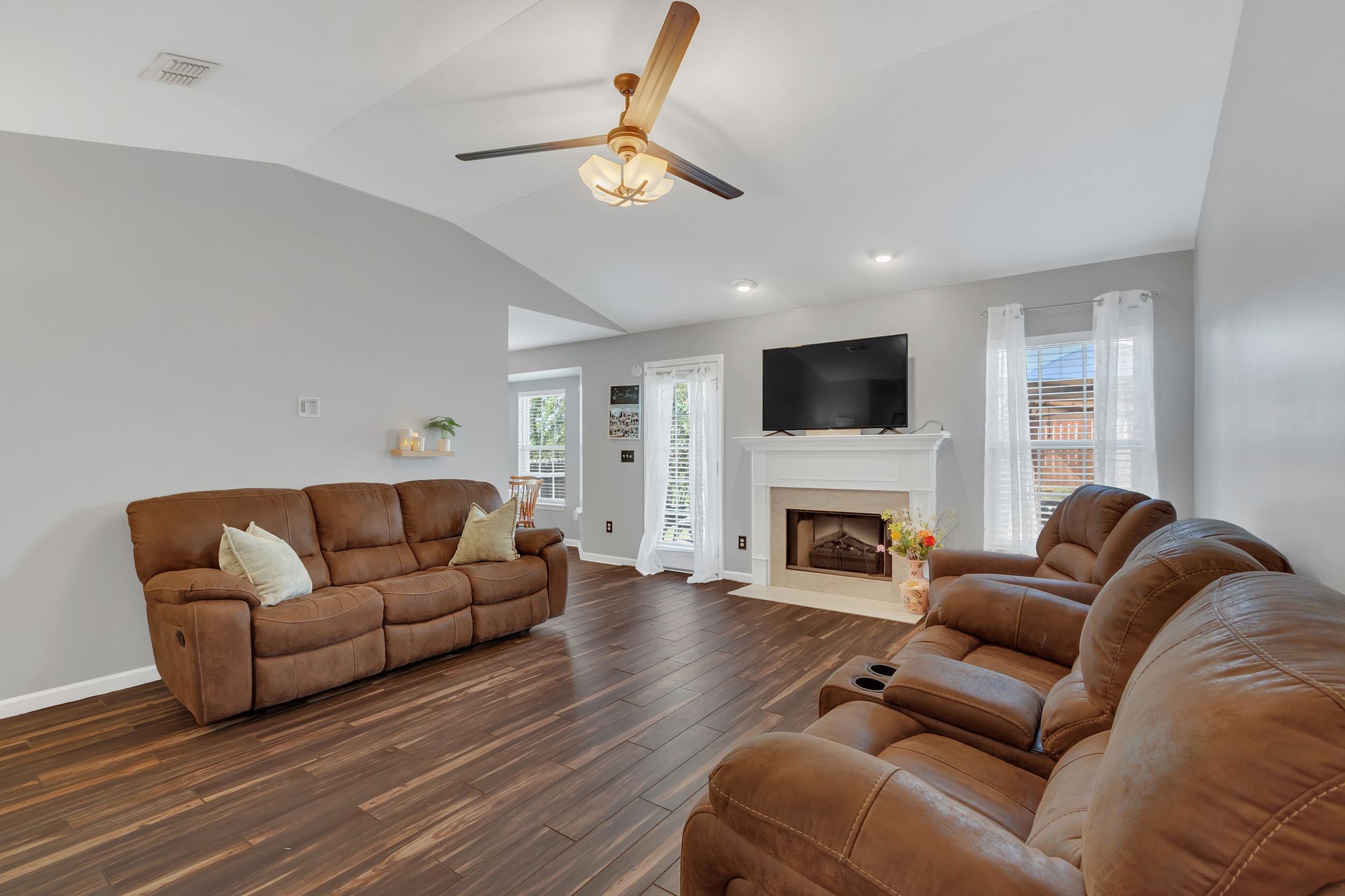 2032 Red Jacket Trace Spring Hill, TN 37174 - Photo 7 of 33 a living room with furniture a fireplace and a flat screen tv