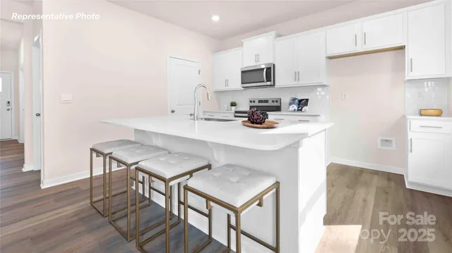 a kitchen with appliances cabinets and a sink
