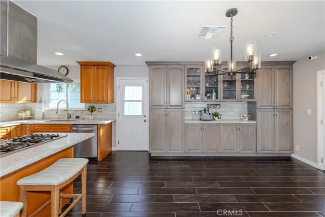 a view of a room with a window and wooden floor