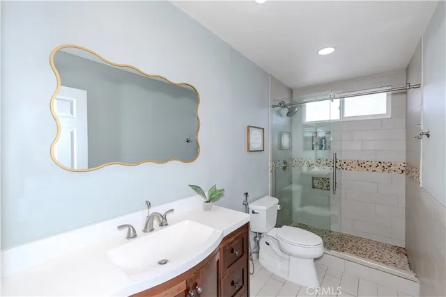 a view of a patio with table and chairs potted plants