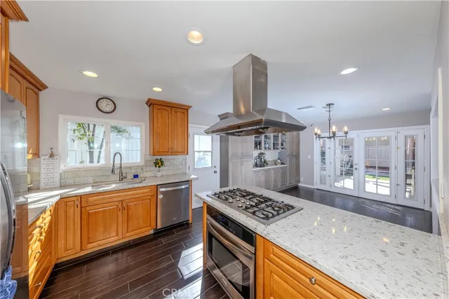 a view of a livingroom with wooden furniture and windows