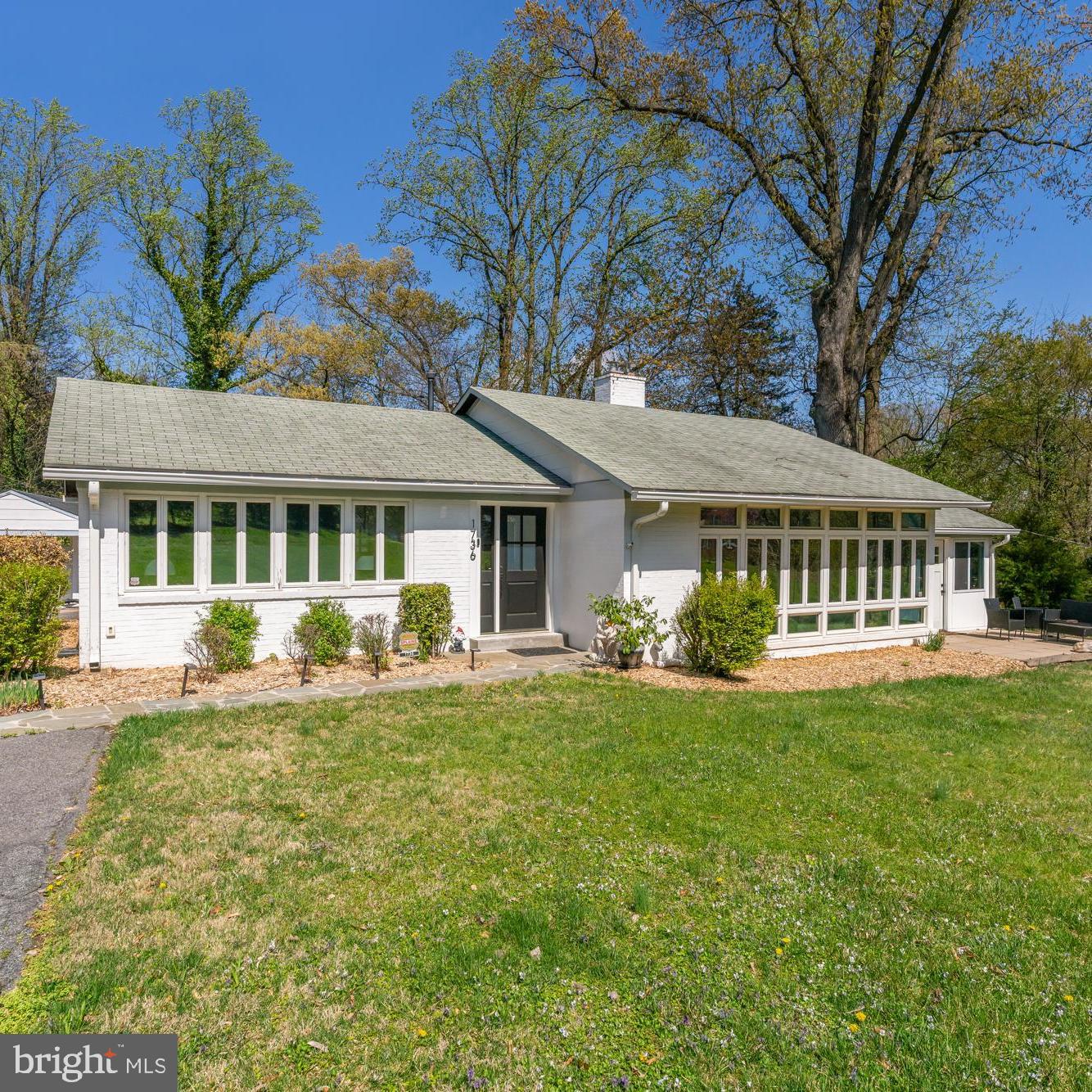 1736 Overlook Drive Silver Spring, MD 20903 - Photo 1 of 42 a front view of a house with swimming pool having outdoor seating