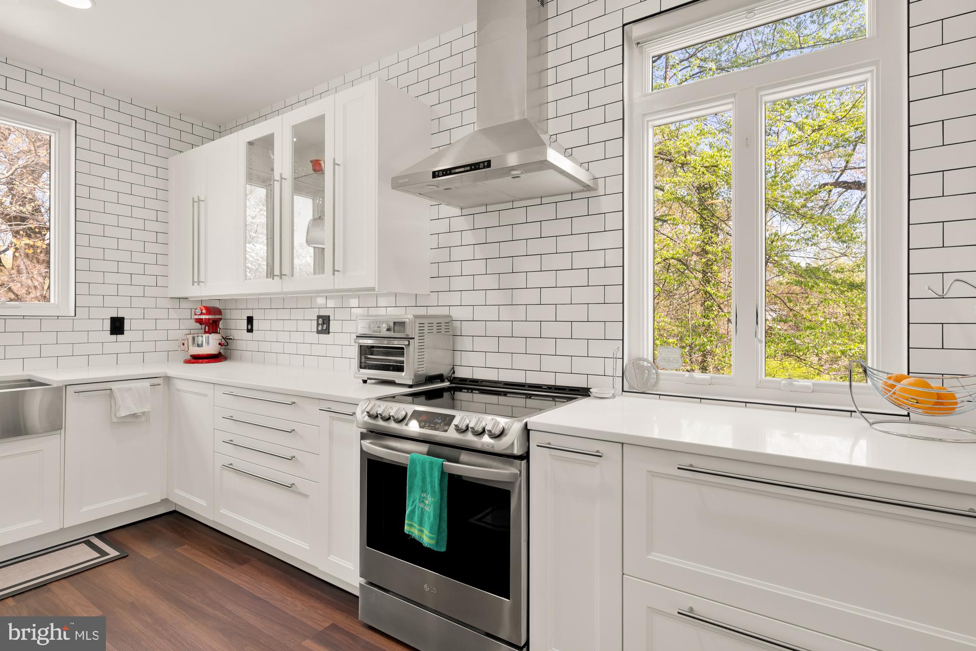 1736 Overlook Drive Silver Spring, MD 20903 - Photo 14 of 42 a kitchen with appliances cabinets and a sink