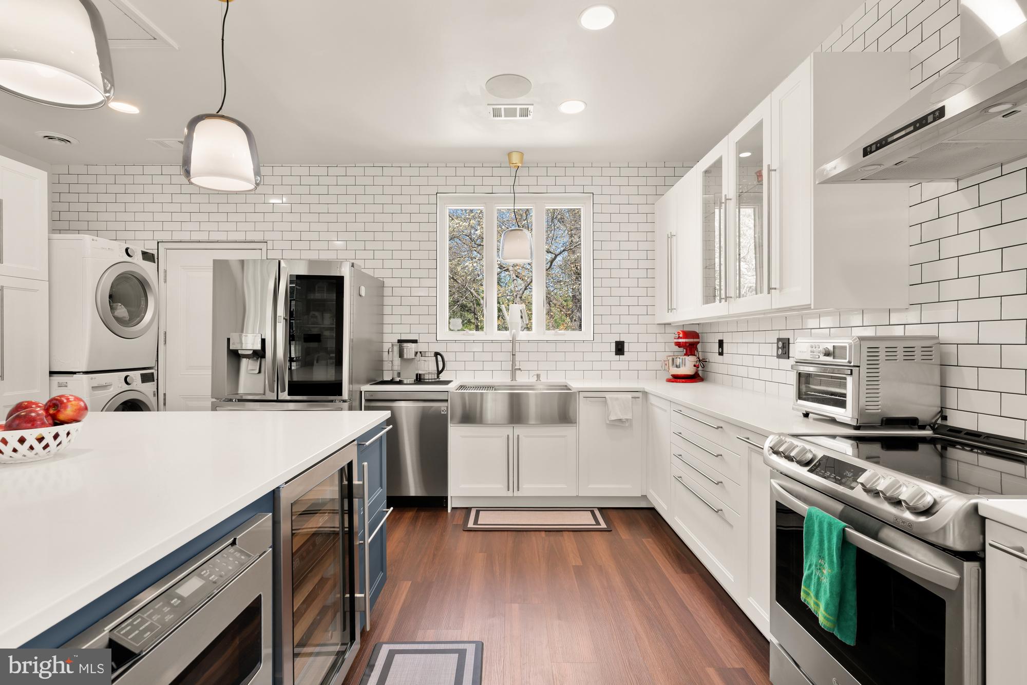 1736 Overlook Drive Silver Spring, MD 20903 - Photo 16 of 42 a kitchen with a sink a stove and cabinets