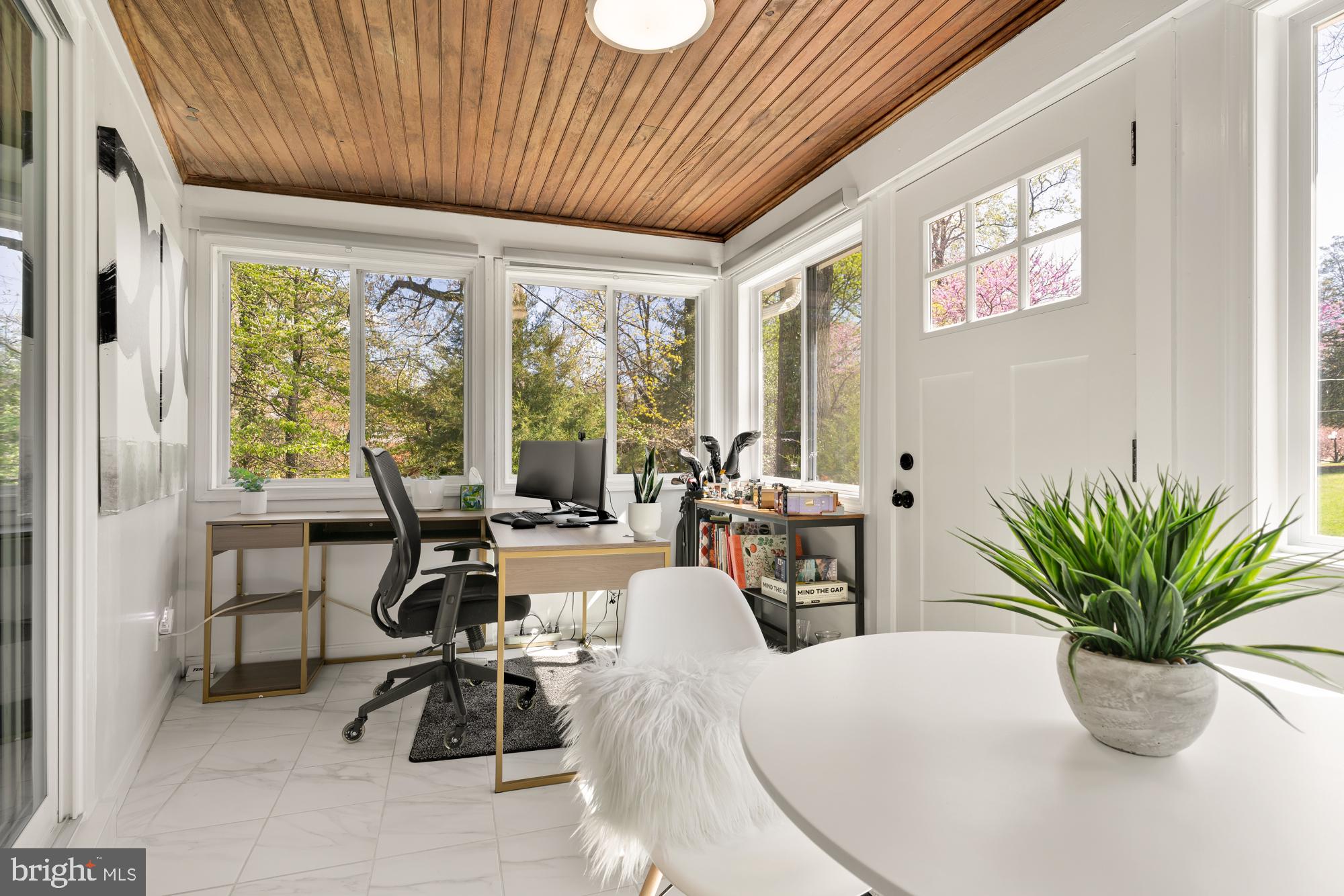 1736 Overlook Drive Silver Spring, MD 20903 - Photo 23 of 42 a living room with furniture potted plant and a large window