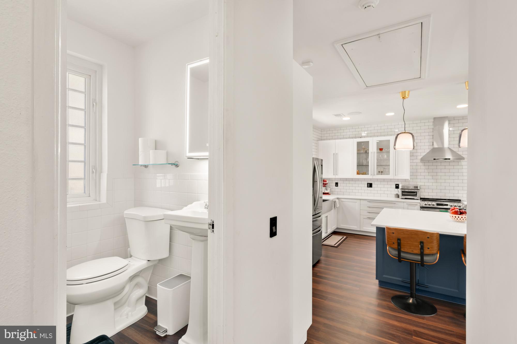 1736 Overlook Drive Silver Spring, MD 20903 - Photo 25 of 42 a bathroom with a toilet a sink a mirror and a shower