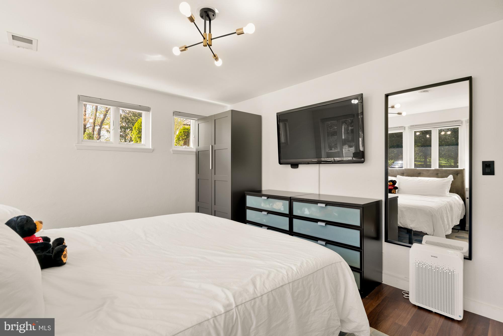 1736 Overlook Drive Silver Spring, MD 20903 - Photo 30 of 42 a bedroom with a bed and a flat screen tv