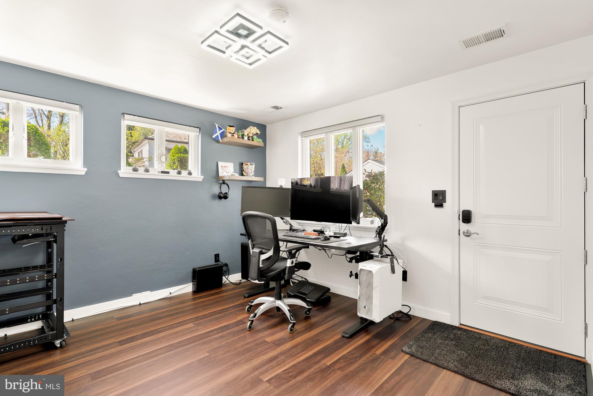 1736 Overlook Drive Silver Spring, MD 20903 - Photo 34 of 42 a view of a workspace with wooden floor and white cabinet