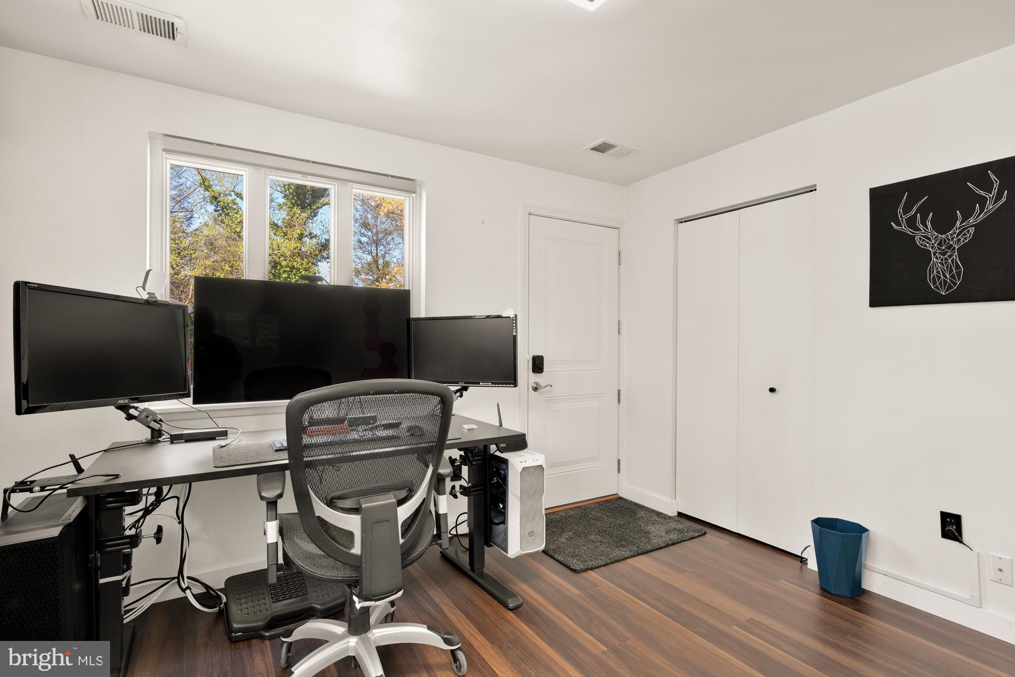 1736 Overlook Drive Silver Spring, MD 20903 - Photo 35 of 42 a view of a workspace with furniture and a flat screen tv