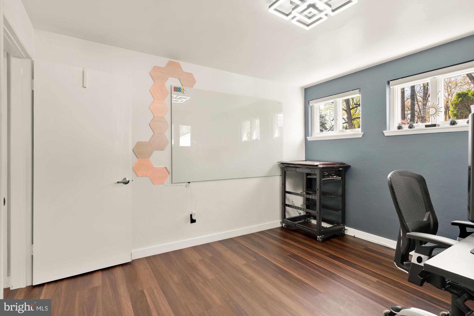 1736 Overlook Drive Silver Spring, MD 20903 - Photo 36 of 42 a view of a workspace with furniture and wooden floor