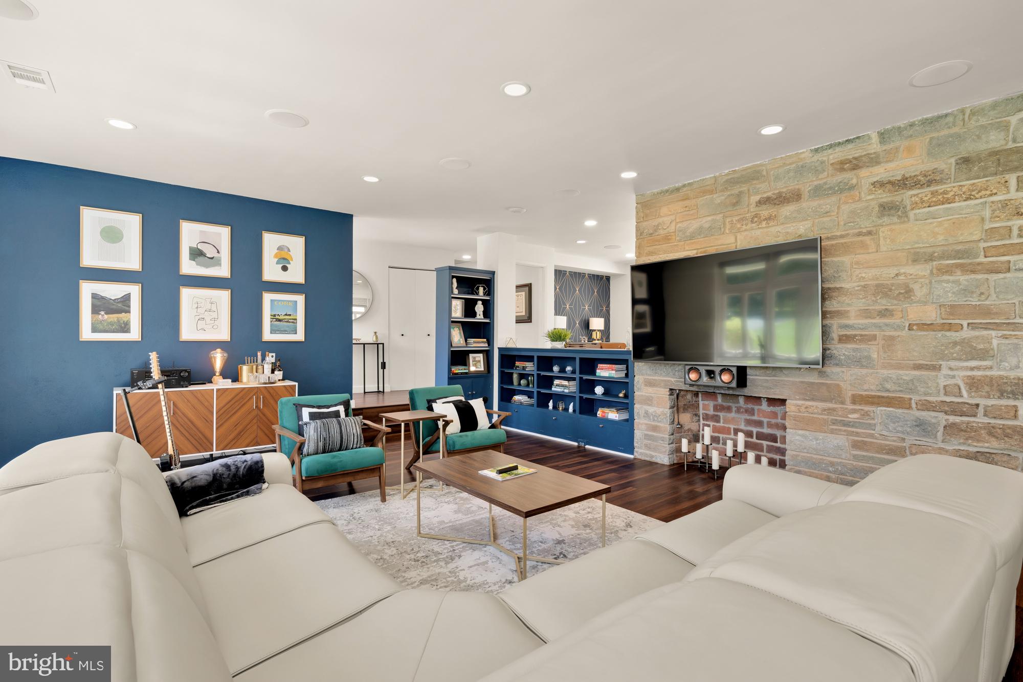 1736 Overlook Drive Silver Spring, MD 20903 - Photo 8 of 42 a living room with furniture and a flat screen tv