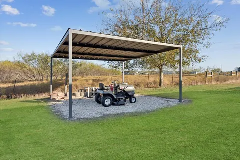 a view of a two chairs in the garden