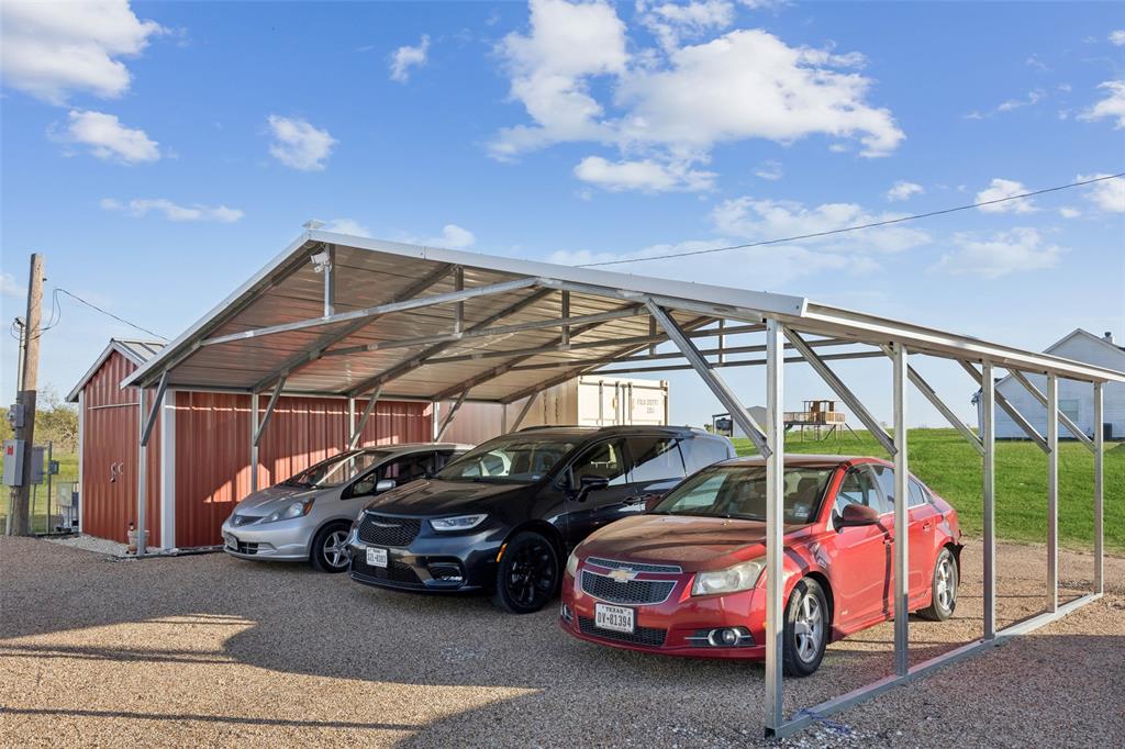 10240 Norrell Road Venus, TX 76084 - Photo 18 of 22 a view of a cars parked in garage