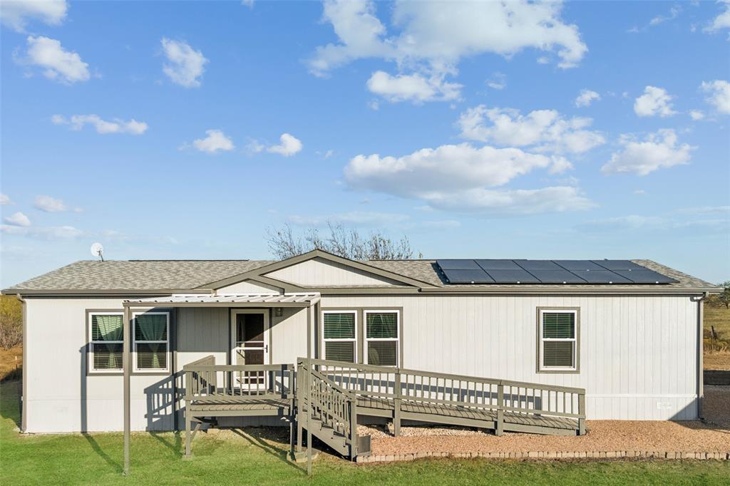 10240 Norrell Road Venus, TX 76084 - Photo 2 of 22 a backyard of a house with table and chairs